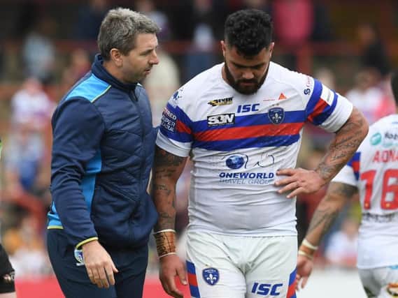 Wakefield Trinity's Dave Fifita, right, with Warrington coach Steve Price after last month's game between the Super League clubs. (Anna Gowthorpe/SWpix.com)