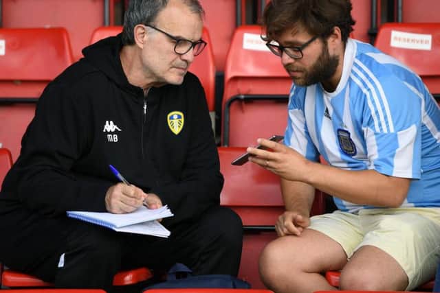Marcelo Bielsa chats to a fellow Argentinian before kick-off at Bootham Crescent.