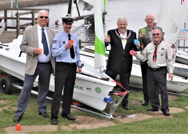 AHOY THERE: Representatives from the Freemasons and the scout sailing centre with one of the new boats.