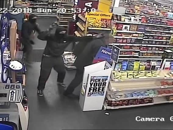 A CCTV image capturing the robbery in action.