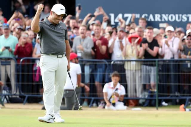 Italy's Francesco Molinari celebrates making birdie on the 18th at Carnoustie. Picture: Jane Barlow/PA