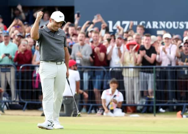 Italy's Francesco Molinari celebrates making birdie on the 18th at Carnoustie. Picture: Jane Barlow/PA