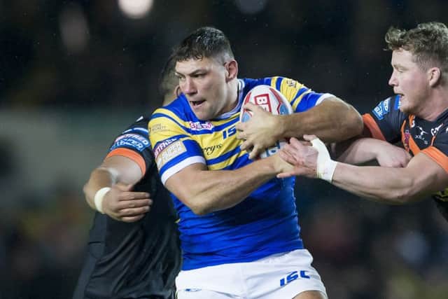 HEADING OFF: Leeds Rhinos' Ryan Hall is tackled by Castleford's Adam Milner. Picture by Allan McKenzie/SWpix.com