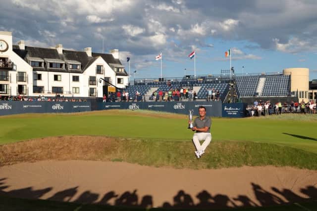 Italy's Francesco Molinari with the The Claret Jug after winning The Open Championship at Carnoustie. Picture: Richard Sellers/PA