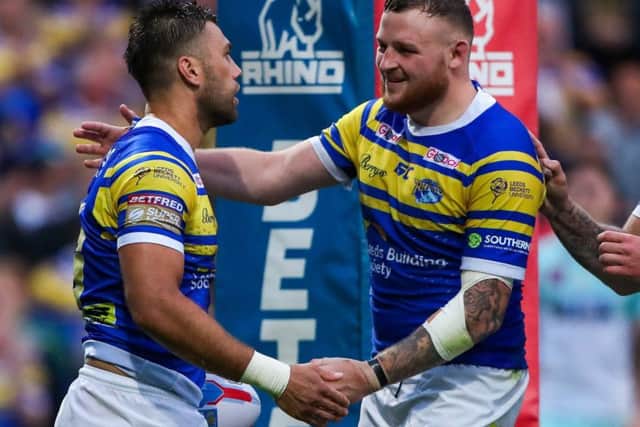Joel Moon celebrates his try against Widnes with Brad Singleton.