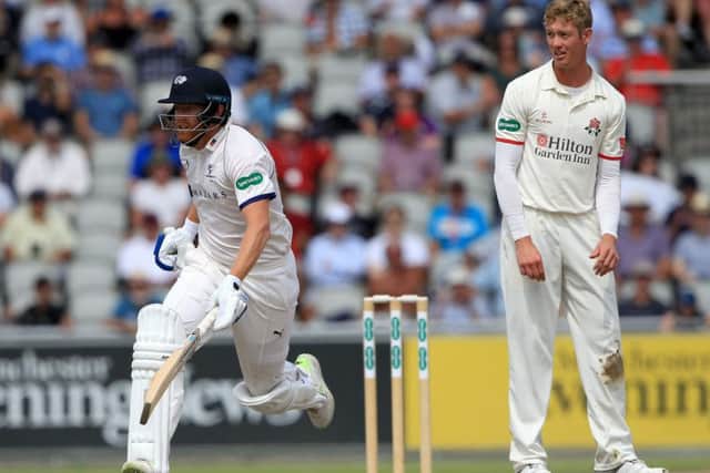 LEADING MAN: Yorkshire's Jonny Bairstow runs a single to reach his half century as Lancashire's Keaton Jennings looks on. Picture:Clint Hughes/Getty Images.