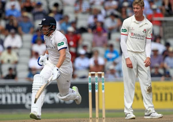 LEADING MAN: Yorkshire's Jonny Bairstow runs a single to reach his half century as Lancashire's Keaton Jennings looks on. Picture:Clint Hughes/Getty Images.