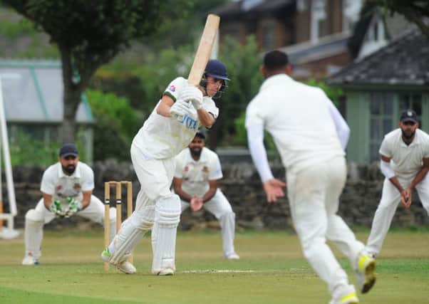 Century-maker: New Farnley opener Simon Lambert on his way to 110 not out against East Bierley.