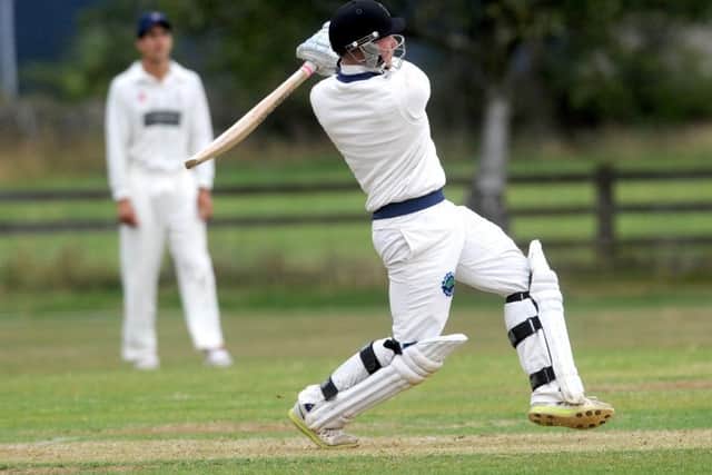 Redmond Bolton hits one of his four sixes scoring 44 off 22 balls for Burley.
