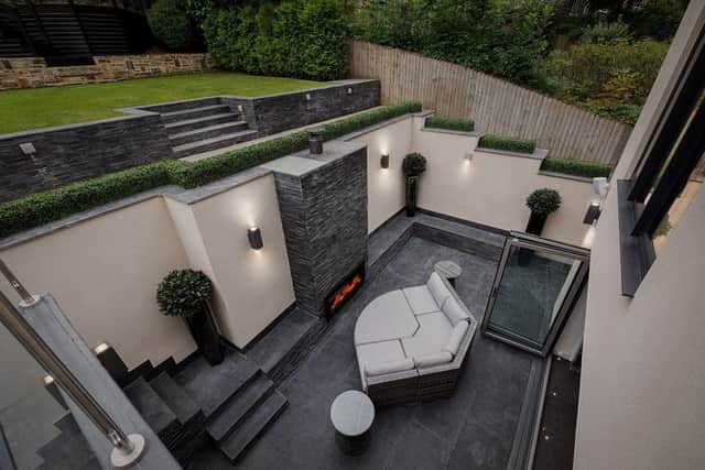 The sunken entertaining space with outdoor fireplace.