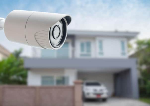 Visible security measures can help protect your home while you are on holiday.
