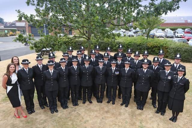 The group of 27 new officers who passed out on Friday are pictured at their passing out parade with their trainers and T/CC Lisa Winward (front right)