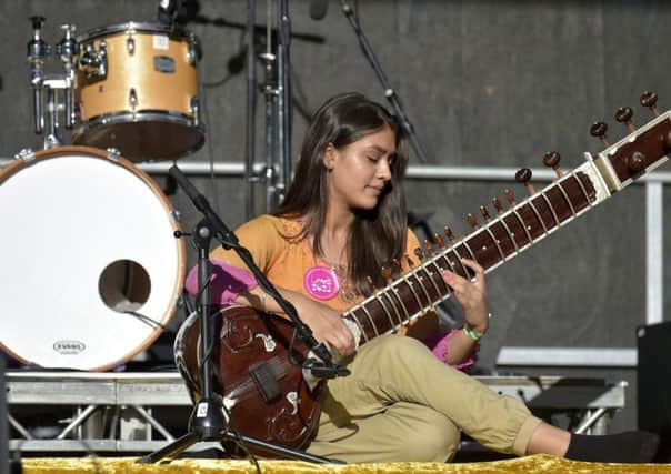 A musician with South Asian Arts performing at a Leeds 2023 bid event.