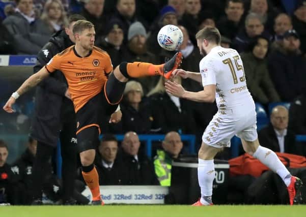 Leeds United target Barry Douglas battles for the ball with Stuart Dallas.