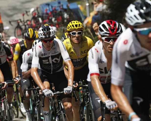 Britain's Chris Froome, center, and Britain's Geraint Thomas, wearing the overall leader's yellow jersey, climb Col d'Aspin pass during the nineteenth stage of the Tour de France. Picture: AP/Christophe Ena