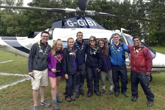 Bear Grylls with scouts by the helicopter