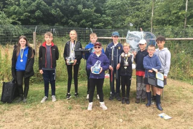 Yarnbury AC winners show off the Old Ball Cup and prizes donated by local businesses, proof that their future is in good hands.