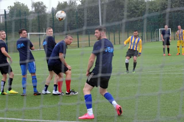 Teams from SBS Contractors, Liversdge and JEM shopfitting , Ossdett took aprt in a charity football match at Bruntcliffe Acadamy to raise money for Candlelighters  sun 29th july 2018
action from the game