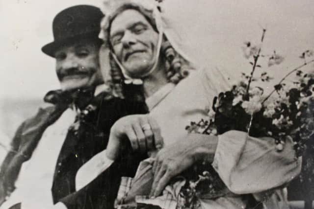 Miners dressed as a bride and groom take part in a "Josh wedding".