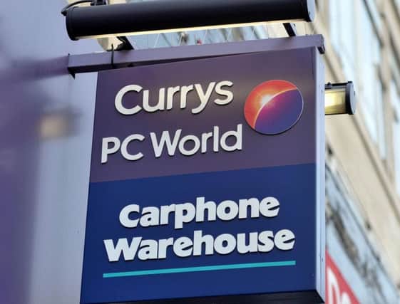 Library image of a branch of Currys PC World, with a Carphone Warehouse inside.  Photo: PA