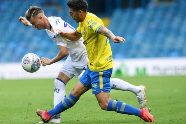 KEEN: Gjanni Alioski takes on Las Palmas' Alvaro Lemos.
Picture: Jonathan Gawthorpe