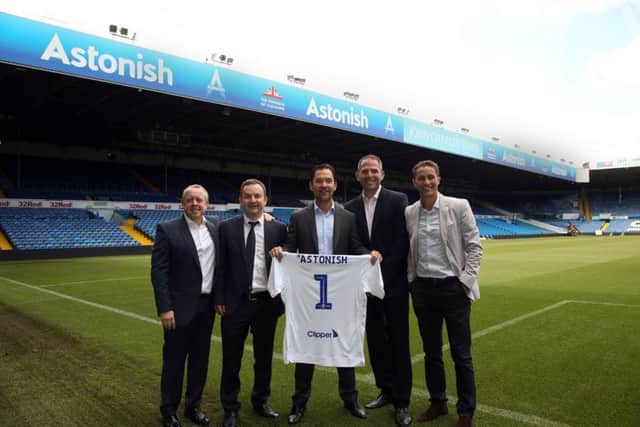 Leeds United's Mark Jacobs, second left, welcomes the Astonish team to Elland Road.