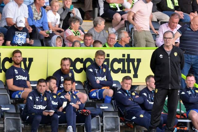 Rob Price (seated, fourth-right) and Marcelo Bielsa during Leeds' recent friendly at Forest Green Rovers. PIC: Bruce Rollinson