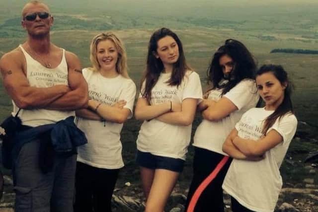 Former student, Abbie Roebuck (far right), pictured with friends and Phil Asquith (far left) at the top of one of the Three Peaks.