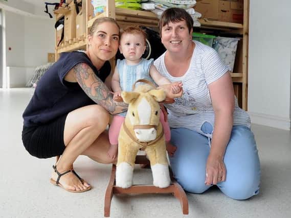 Leeds Baby Bank volunteers Liz Conner, with daughter Sicily, and Jackie Appleton.