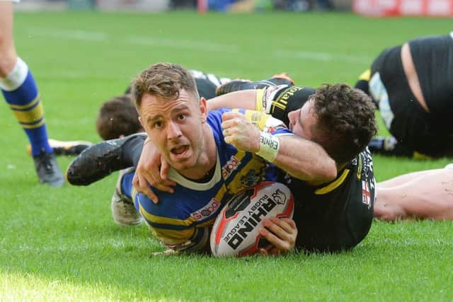 Leeds Rhinos' Richie Myler goes over to score but the try is disallowed due to a forward pass.