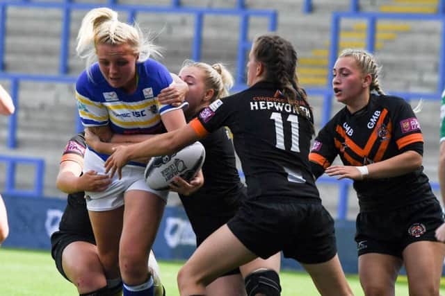 Action from women's Challenge Cup final between Leeds Rhinos and Castleford Tigers.