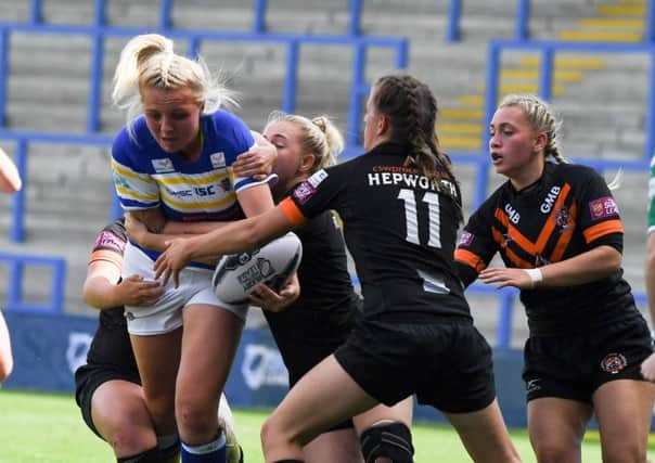 Action from women's Challenge Cup final between Leeds Rhinos and Castleford Tigers.