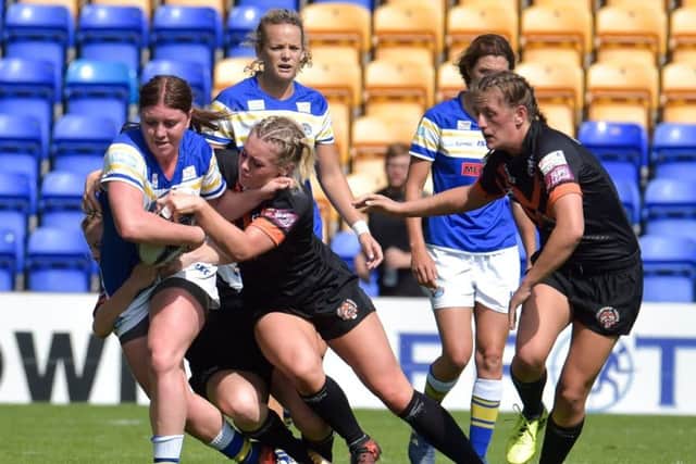 Leeds Rhinos on the attack against Castleford Tigers in the women's Challenge Cup final.