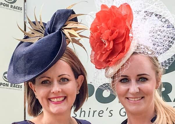 Harrogate milliner Jenny Roberts and Adele Mulrennan, wife of jockey Paul, at Ripon Races Ladies Day June 2018. Adele is the raceday presenter for Yorkshire Racecourses.