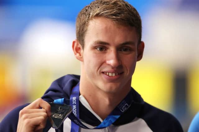 Ben Proud shows off the silver medal he won in the mens 50m butterfly in Edinburgh (Picture: John Walton/PA Wire).