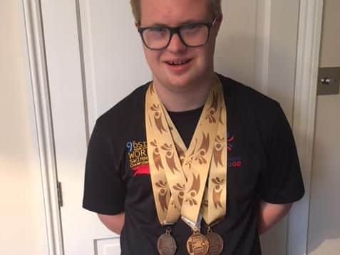 Pictured: Will Lake with his three Bronze  heat medals.