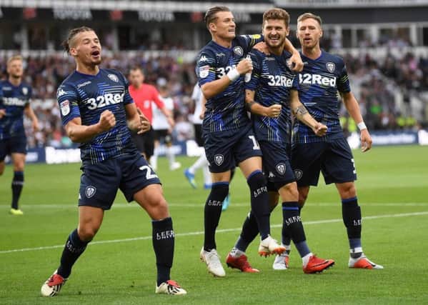 Leeds United's players celebrate after opening the scoring at Pride Park,