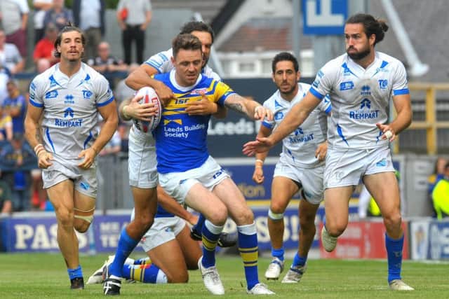 Richie Myler looks to break free from the Toulouse defence.