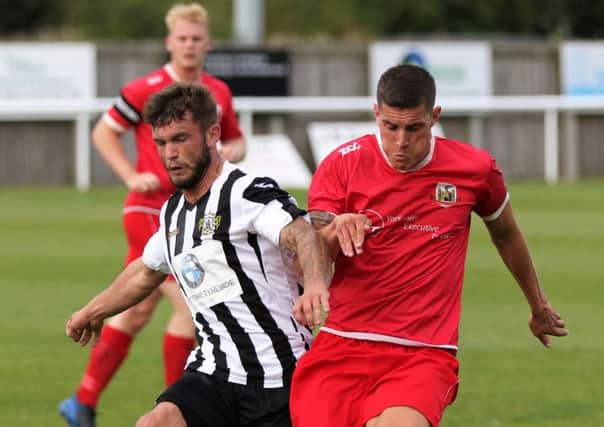 GOING THROUGH: Knaresborough Town and Lawrence Hunter, right, recorded a 2-0 win at Ashington in the FA Cup extra preliminary round. Picture by Craig Dinsdale.