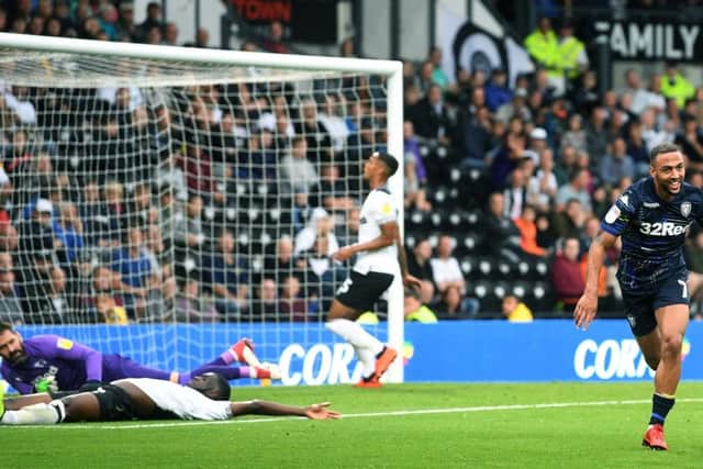 'BEAUTIFUL': Leeds United striker Kemar Roofe leaves the Derby County defence toiling to score his side's second goal. Picture by Jonathan Gawthorpe.