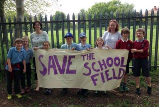Parents' campaign to save the field for the school.