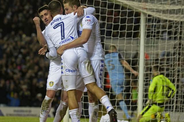 In at the double: Chris Wood celebrates his second goal with Pablo Hernandez and Kemar Roofe.