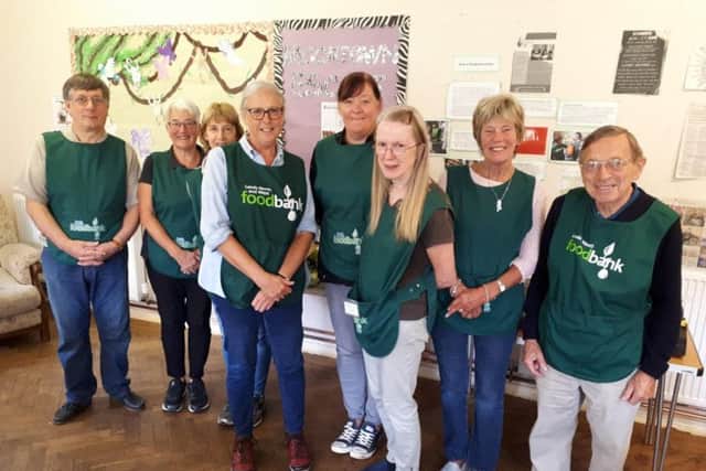 Food bank volunteers, including Audrey Reed (third from right).