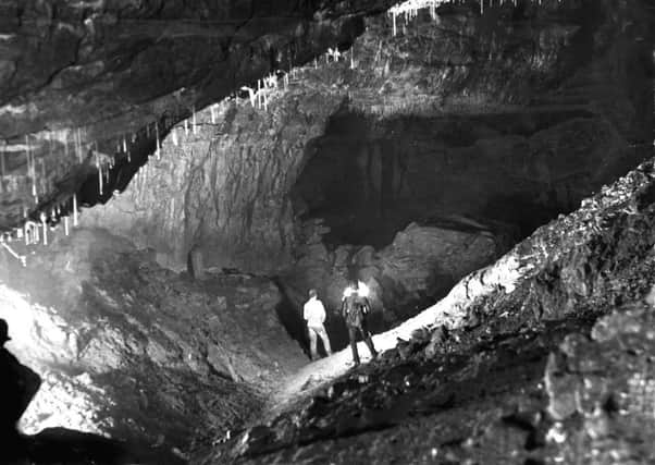 Gaping Ghyll caverns, 1935

Nearly 400 feet below ground in Gaping Ghyll, one of the caverns on the South West Passage.