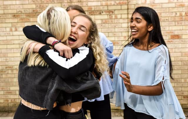 Issy Armstrong a 'A' level pupil at The Grammar School at Leeds,  celebrates her results with her friends
