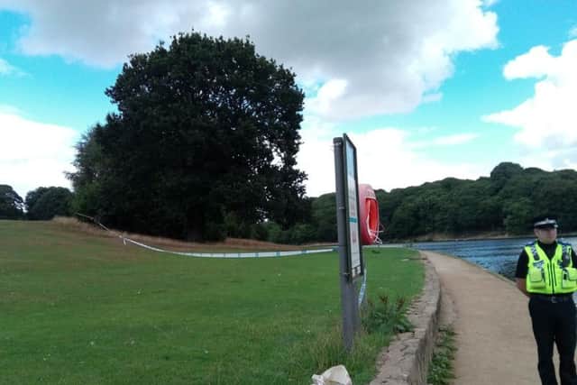 A PCSO guards the scene at Waterloo Lake in Roundhay Park