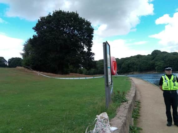 A PCSO guards the scene at Waterloo Lake in Roundhay Park