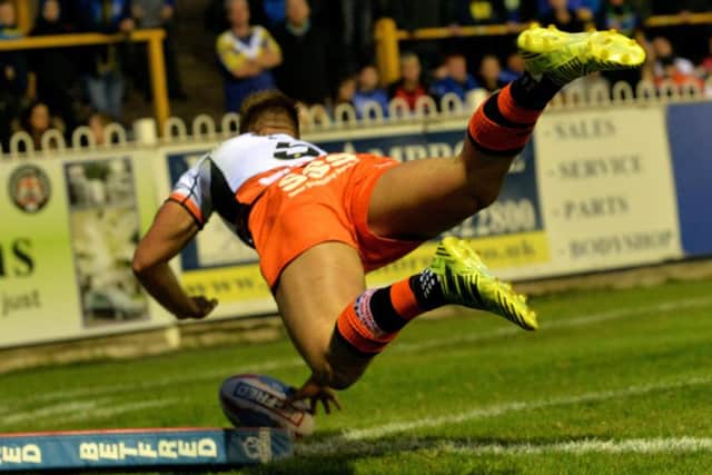 Greg Eden dives over the line to score Castleford's third try against Warrington. Picture: Bruce Rollinson.
