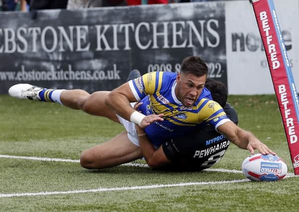 Joel Moon touches down for the second of three quick-fire tries that kept London at bay. PIC: Max Flego/RLPhotos.com