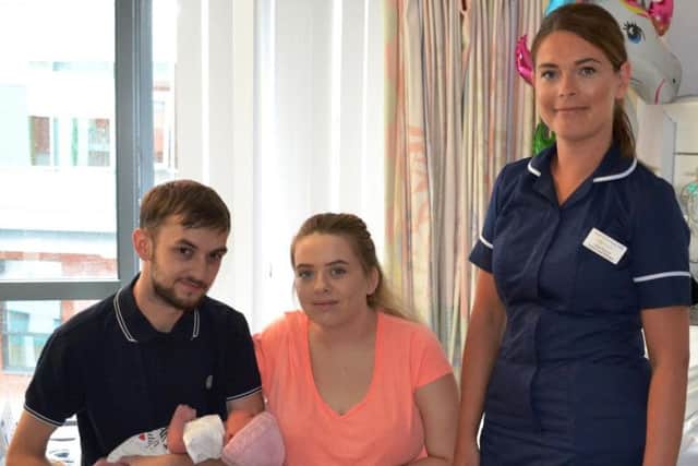 L-R; Dad Aaron Broadhead holding baby Skyler-Grace, mum Emily Barker with Senior Sister Sarah Brennan from the Labour Ward at Pinderfields Hospital.